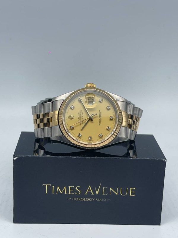 Preowned Rolex Datejust 36 16233 two-tone yellow gold champagne dial with 10 diamond markers and Jubilee bracelet.