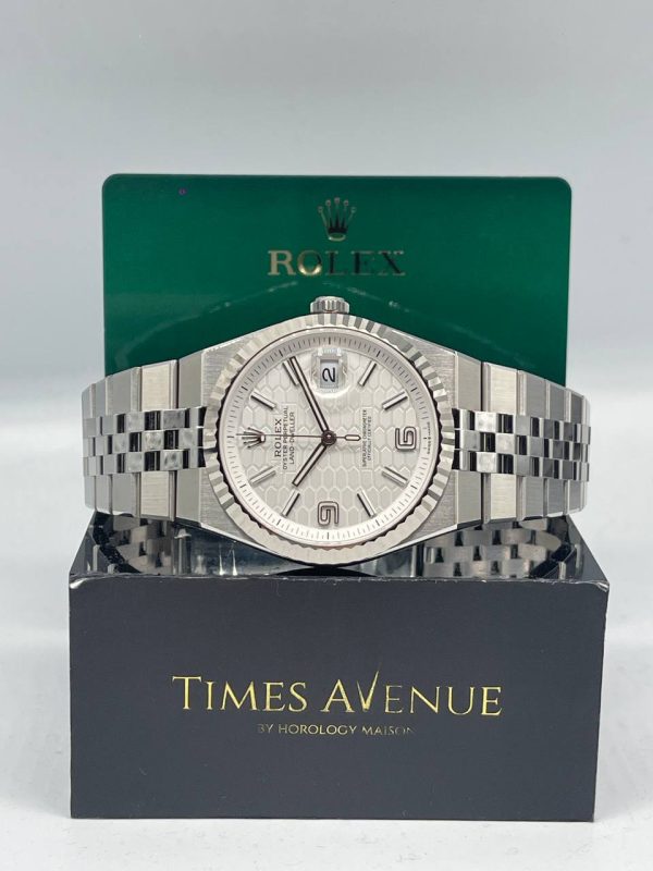 Mint 2026 Rolex Land-Dweller 40 127334 white honeycomb motif dial with fluted bezel and Flat Jubilee bracelet.