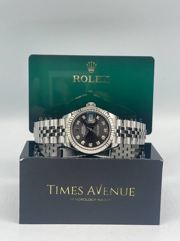 Mint 2022 Rolex Datejust 28 279174 dark grey dial with 10 factory diamonds white gold fluted bezel and Jubilee bracelet.