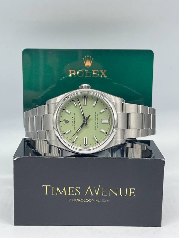 Mint condition 2025 Rolex Oyster Perpetual 36 126000 steel watch with pistachio green dial and protective film in Singapore.